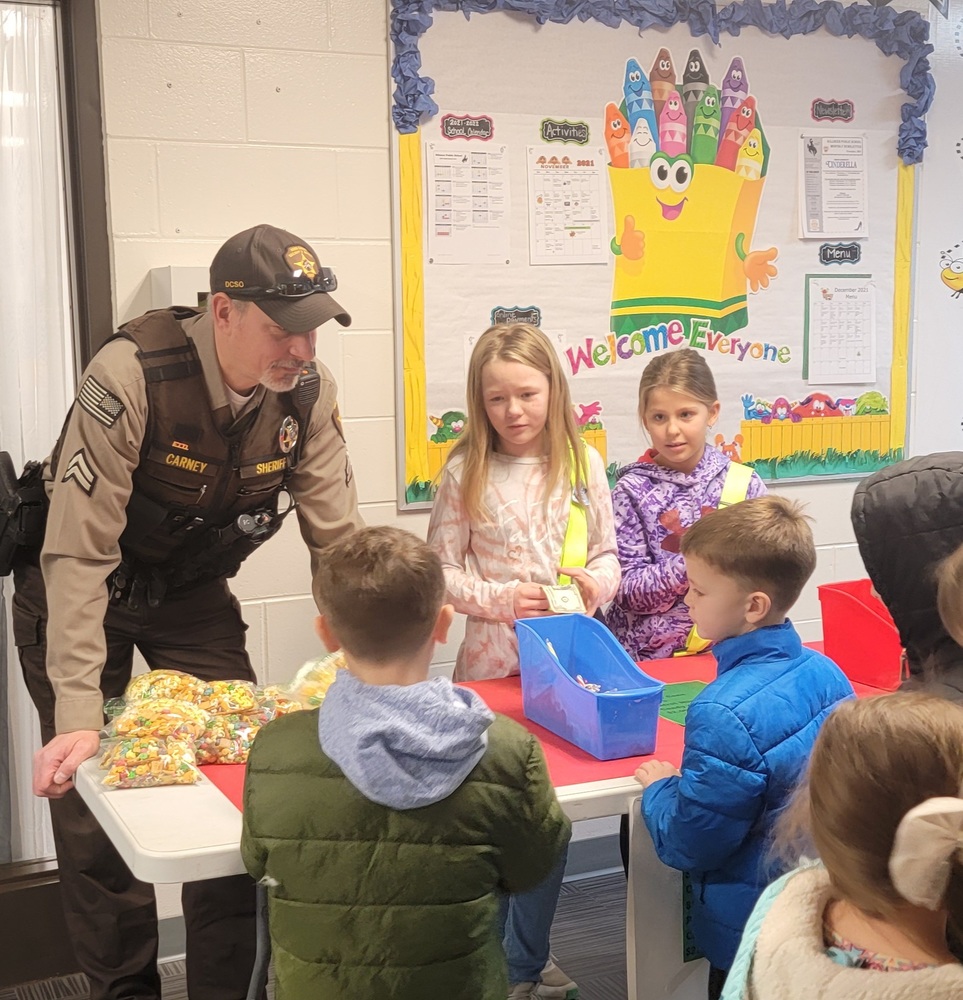Officer and Safety Patrol students selling patrol mix