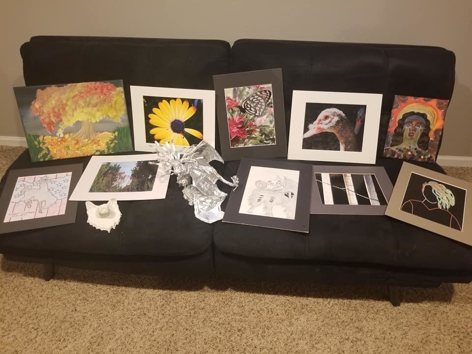 Futon with variety of KHS student art work displayed